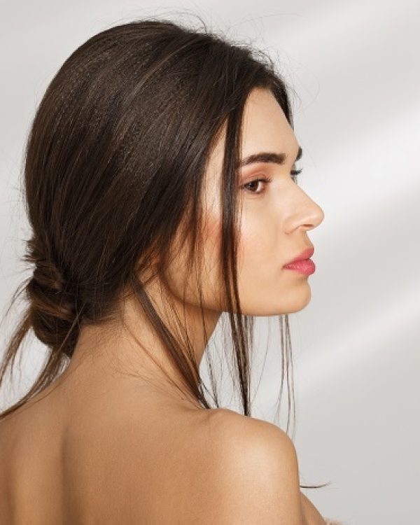 Close up portrait of a beatiful woman profile relaxing after spa procedures.
